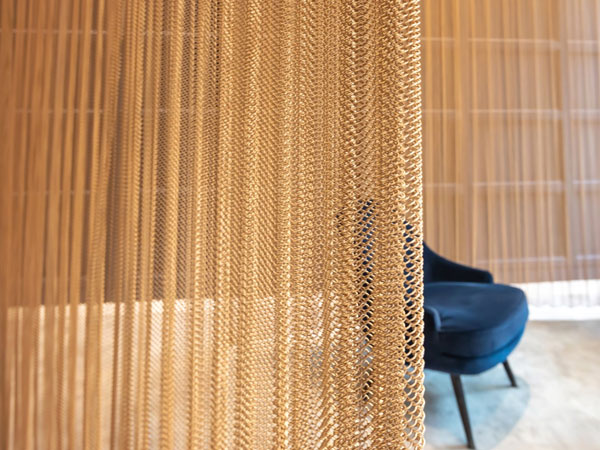 How should metal mesh curtains be installed?