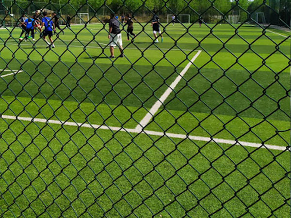 What needs to be considered when installing sports field fencing?